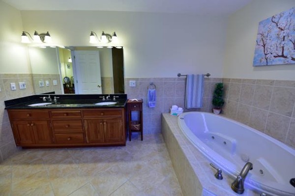 102 Argilla Road Andover, MA 01810 - Photo 23 of 30 a spacious bathroom with a bathtub sink and mirror