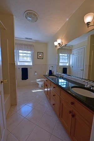 102 Argilla Road Andover, MA 01810 - Photo 28 of 30 a large bathroom with double vanity and a mirror