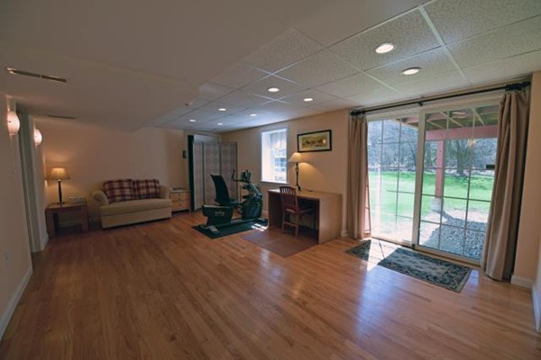 102 Argilla Road Andover, MA 01810 - Photo 30 of 30 a living room with furniture and a fireplace