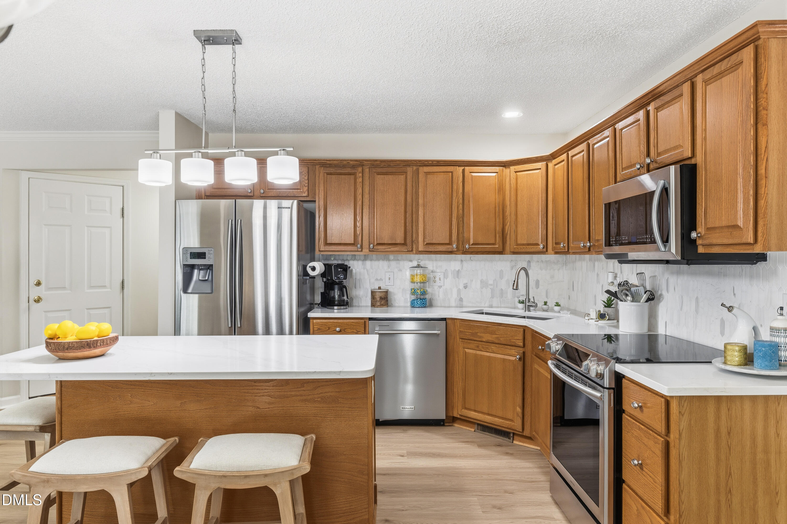 1211 Waterford Green Drive Apex, NC 27502 - Photo 23 of 53 a kitchen with a sink cabinets and window