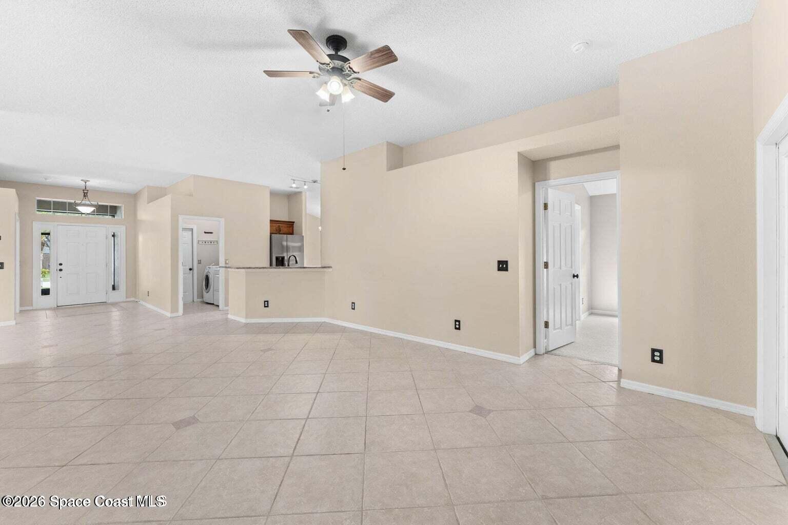4741 Decatur Circle Melbourne, FL 32934 - Photo 9 of 44 a view of a livingroom with a chandelier fan and entryway