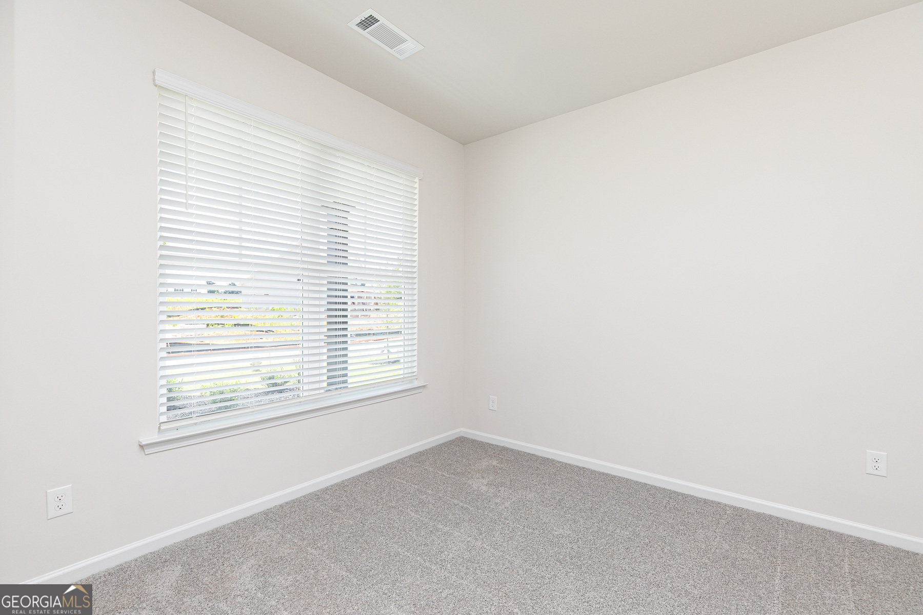 495 Prescott Way Villa Rica, GA 30180 - Photo 4 of 13 an empty room with a window
