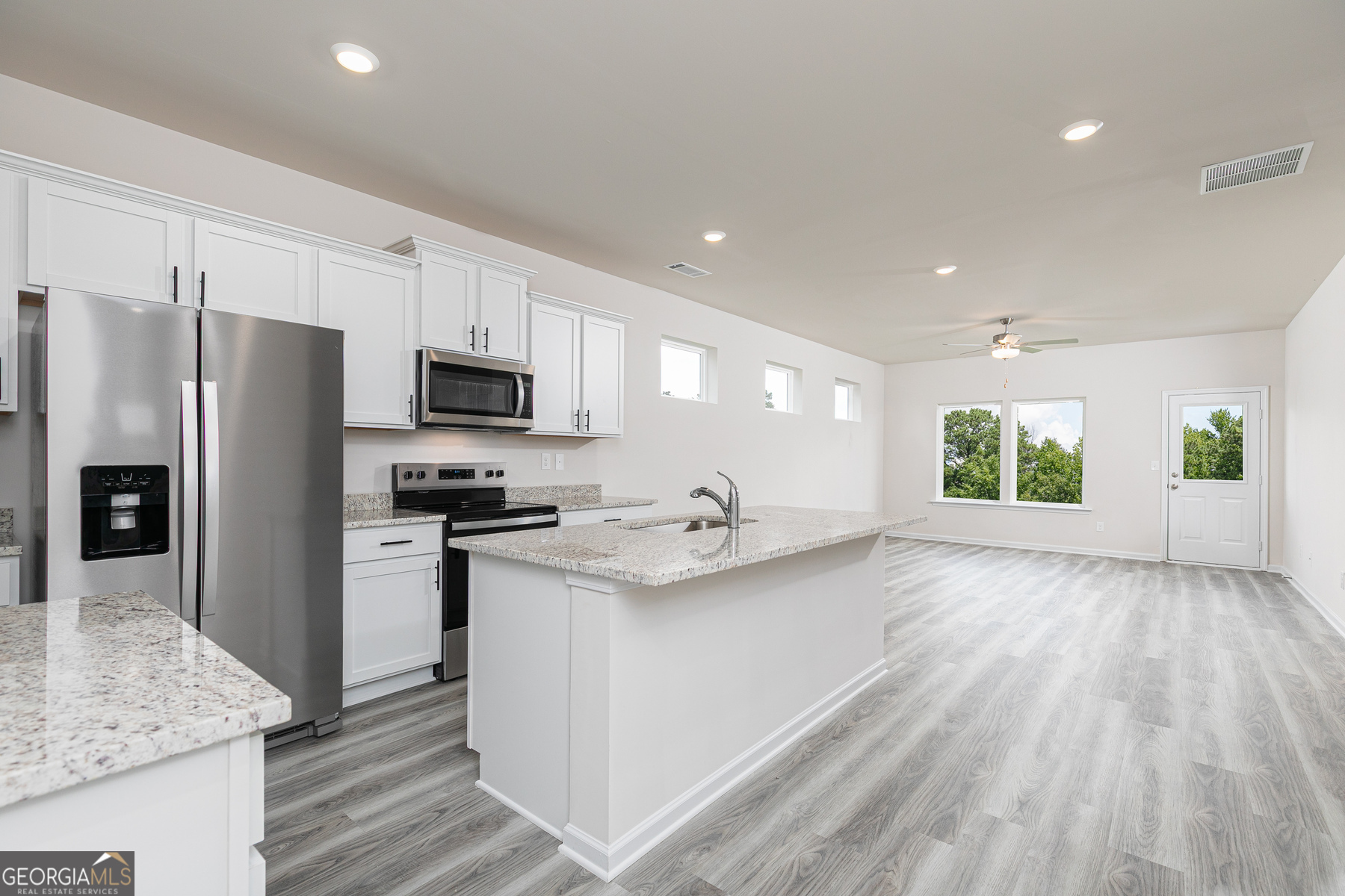 495 Prescott Way Villa Rica, GA 30180 - Photo 5 of 13 a kitchen with stainless steel appliances granite countertop a sink stove and refrigerator