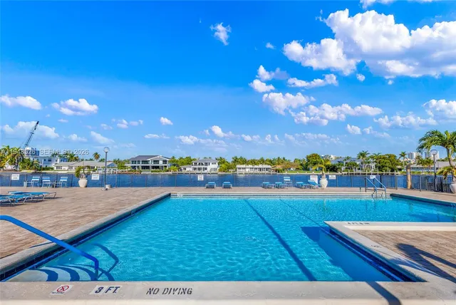 a view of swimming pool with outdoor seating