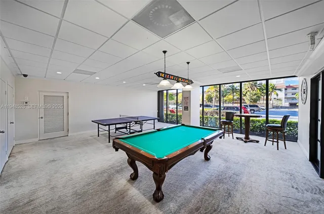 a living room with furniture toys and a large window