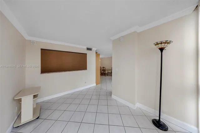 a view of an empty room with windows