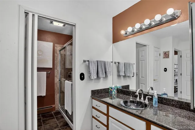 a bedroom with bed and window