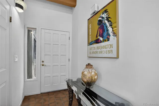 a view of a livingroom with furniture and hardwood floor