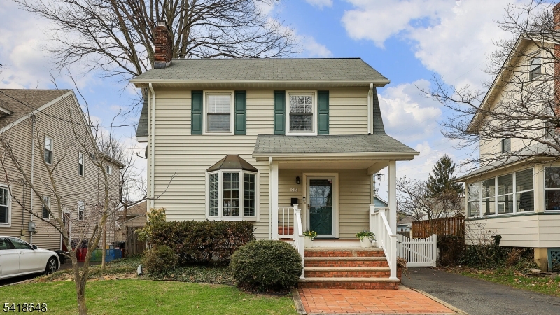 25 Paterson Road Fanwood, NJ 07023 - Photo 1 of 32 a front view of a house with a yard