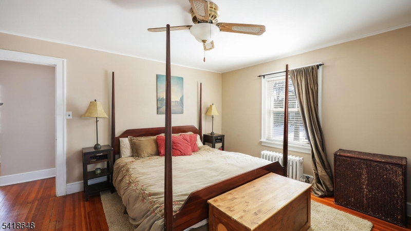 25 Paterson Road Fanwood, NJ 07023 - Photo 13 of 32 a bedroom with a bed and a window