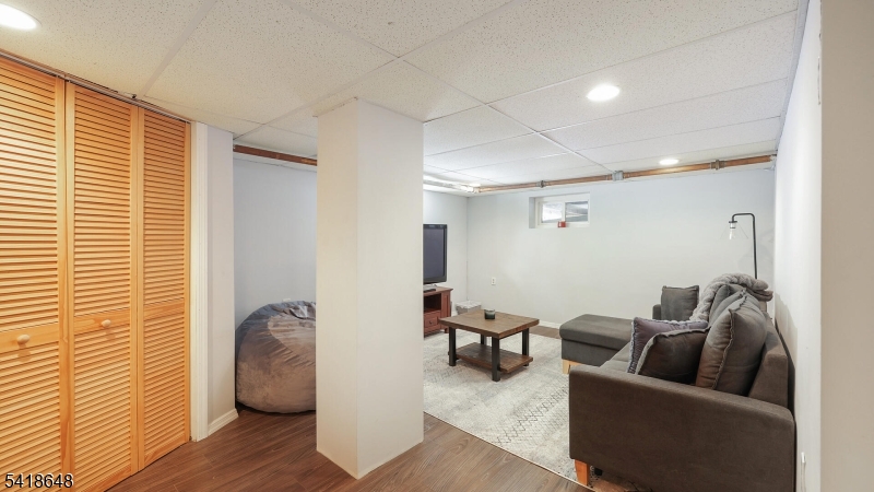 25 Paterson Road Fanwood, NJ 07023 - Photo 19 of 32 a living room with furniture and a window