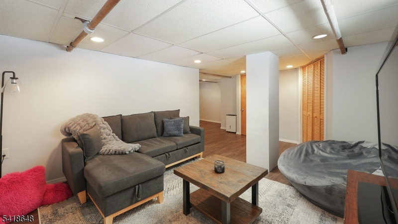25 Paterson Road Fanwood, NJ 07023 - Photo 20 of 32 a living room with furniture and a table