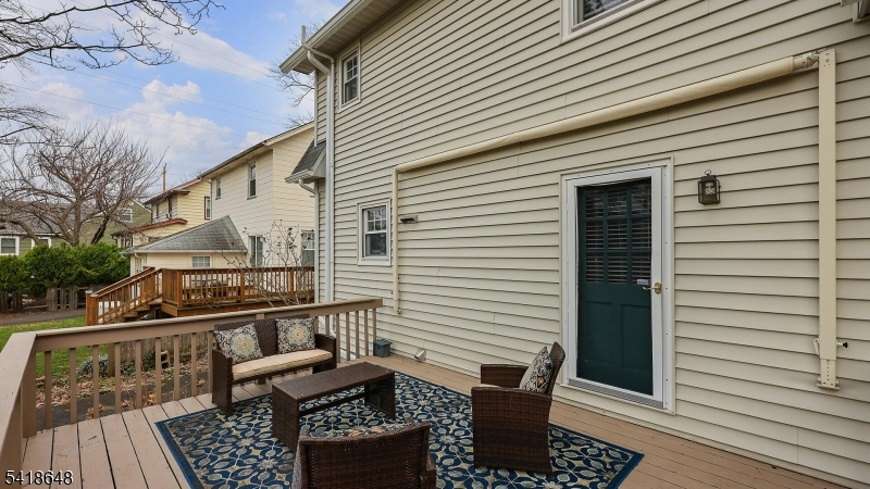25 Paterson Road Fanwood, NJ 07023 - Photo 30 of 32 a view of balcony with furniture and wooden floor