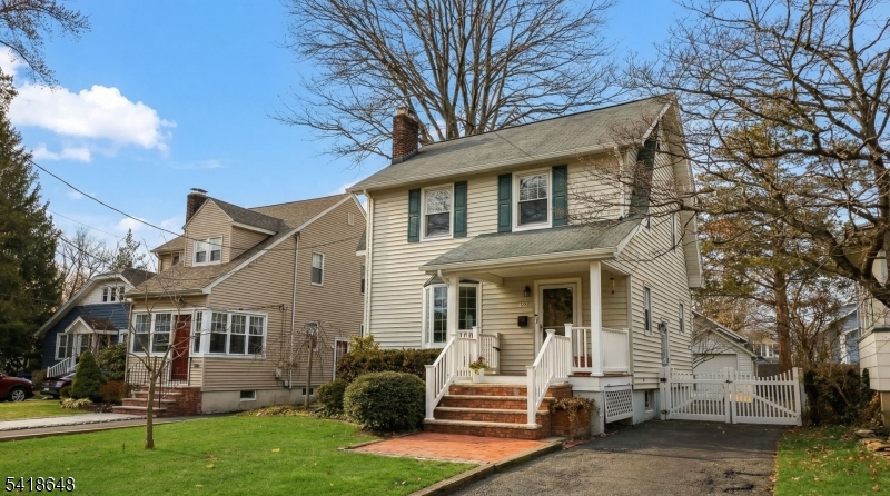 25 Paterson Road Fanwood, NJ 07023 - Photo 32 of 32 a front view of a house with a yard