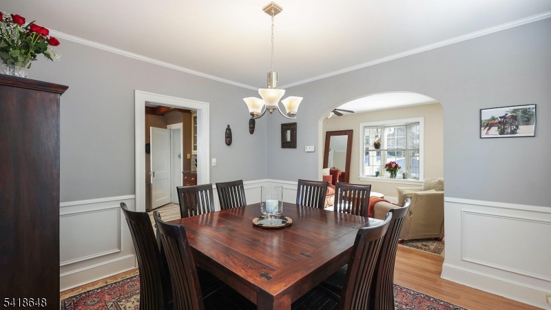 25 Paterson Road Fanwood, NJ 07023 - Photo 9 of 32 a view of a dining room with furniture and wooden floor