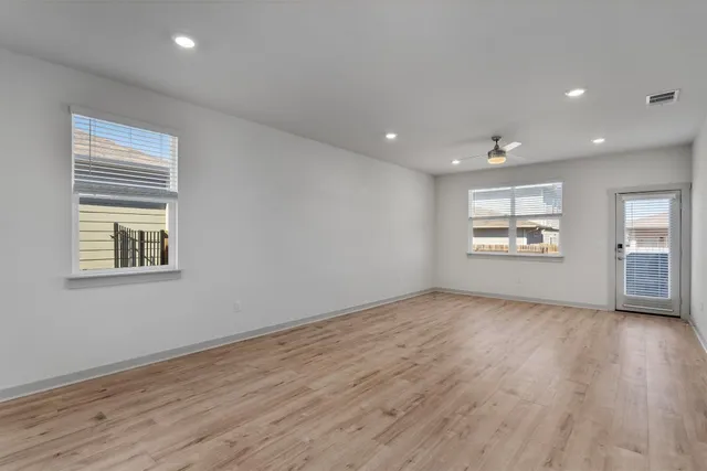 a kitchen with stainless steel appliances granite countertop a sink a stove and a microwave