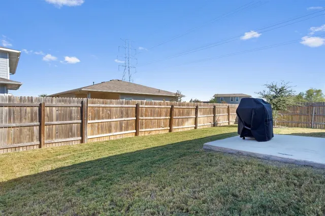a view of outdoor space with deck and barbeque oven