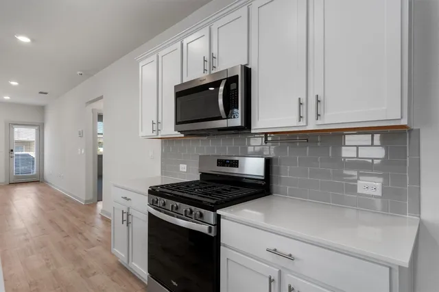 a kitchen that has a sink and a window