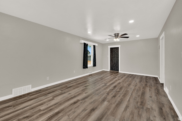 716 East Factory Street Garland, UT 84312 - Photo 8 of 30 Spacious room featuring wood-finish flooring, recessed lighting, and a modern ceiling fan