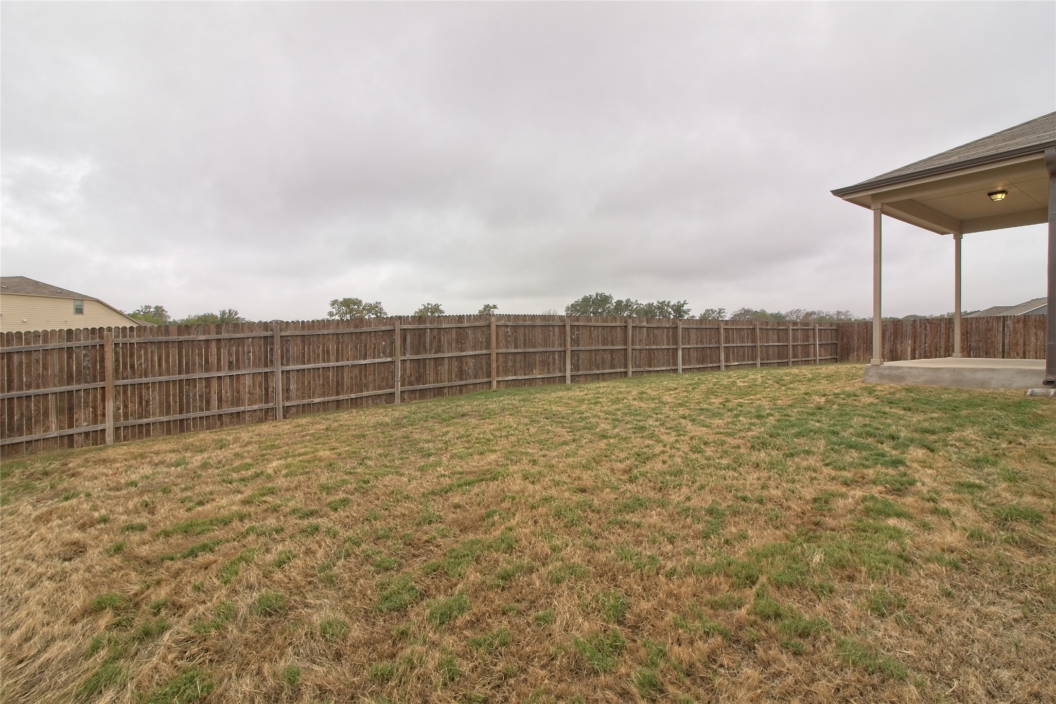 601 Hummingbird Lane Leander, TX 78641 - Photo 25 of 35 Fenced backyard with a patio area
