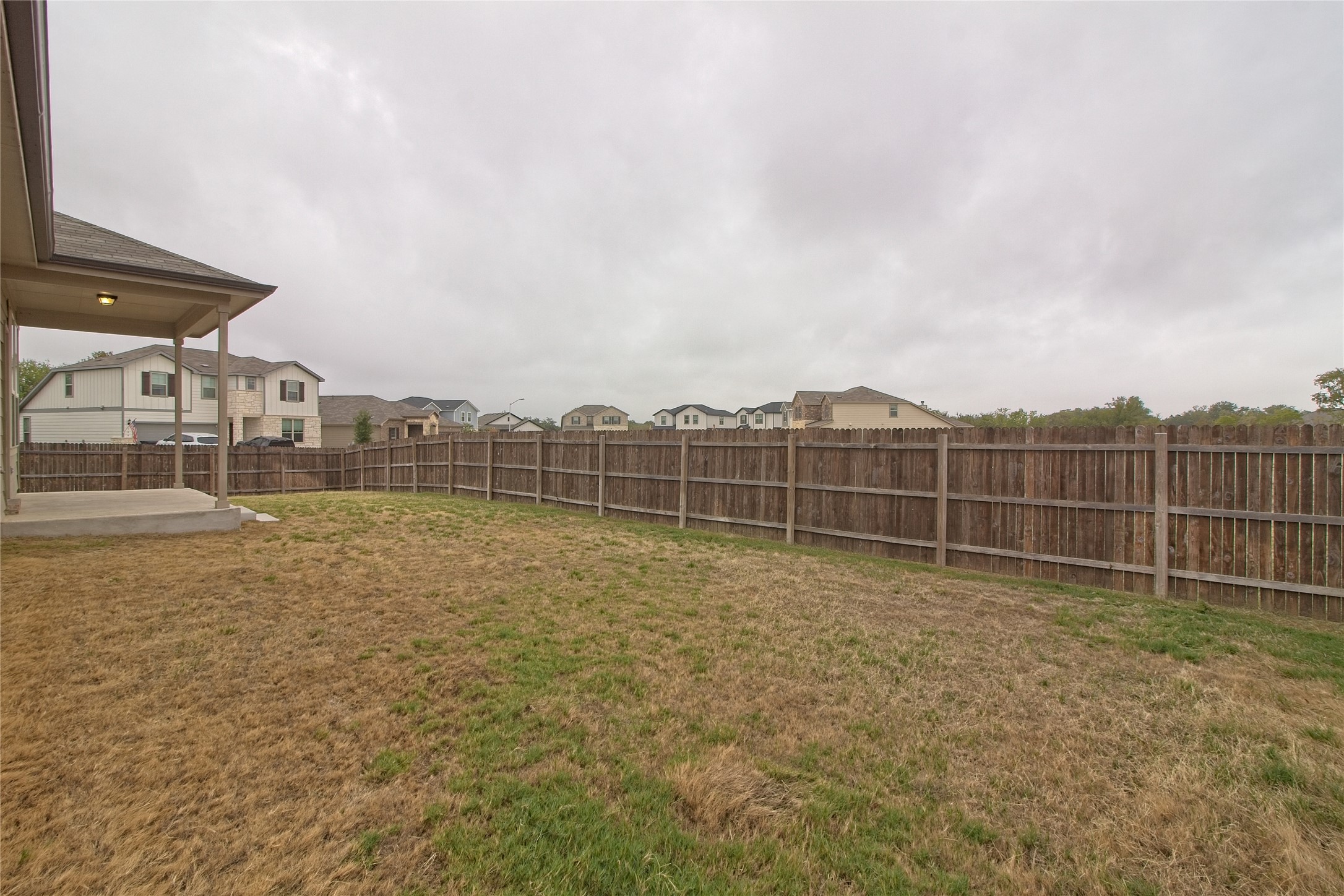 601 Hummingbird Lane Leander, TX 78641 - Photo 27 of 35 Fenced backyard with a patio area and a residential view