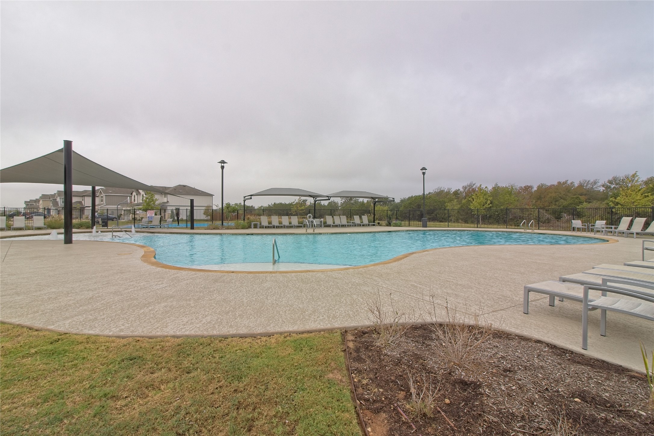 601 Hummingbird Lane Leander, TX 78641 - Photo 32 of 35 Community pool featuring a patio area