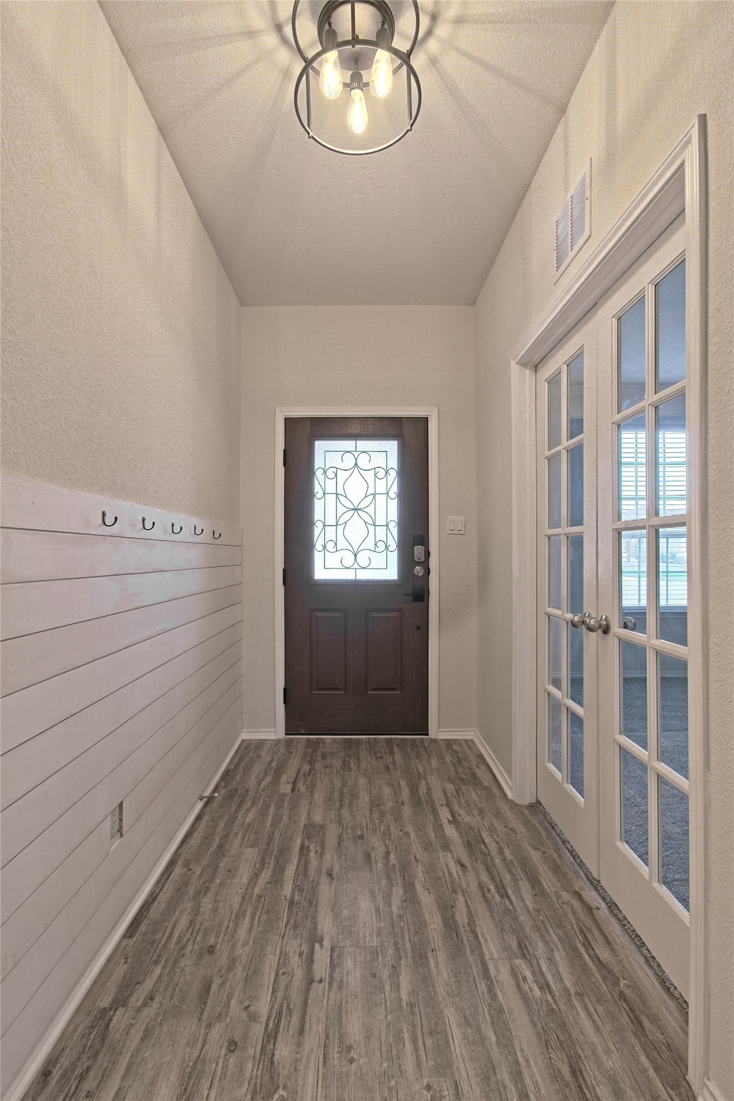 601 Hummingbird Lane Leander, TX 78641 - Photo 5 of 35 Foyer with wood finished floors and french doors