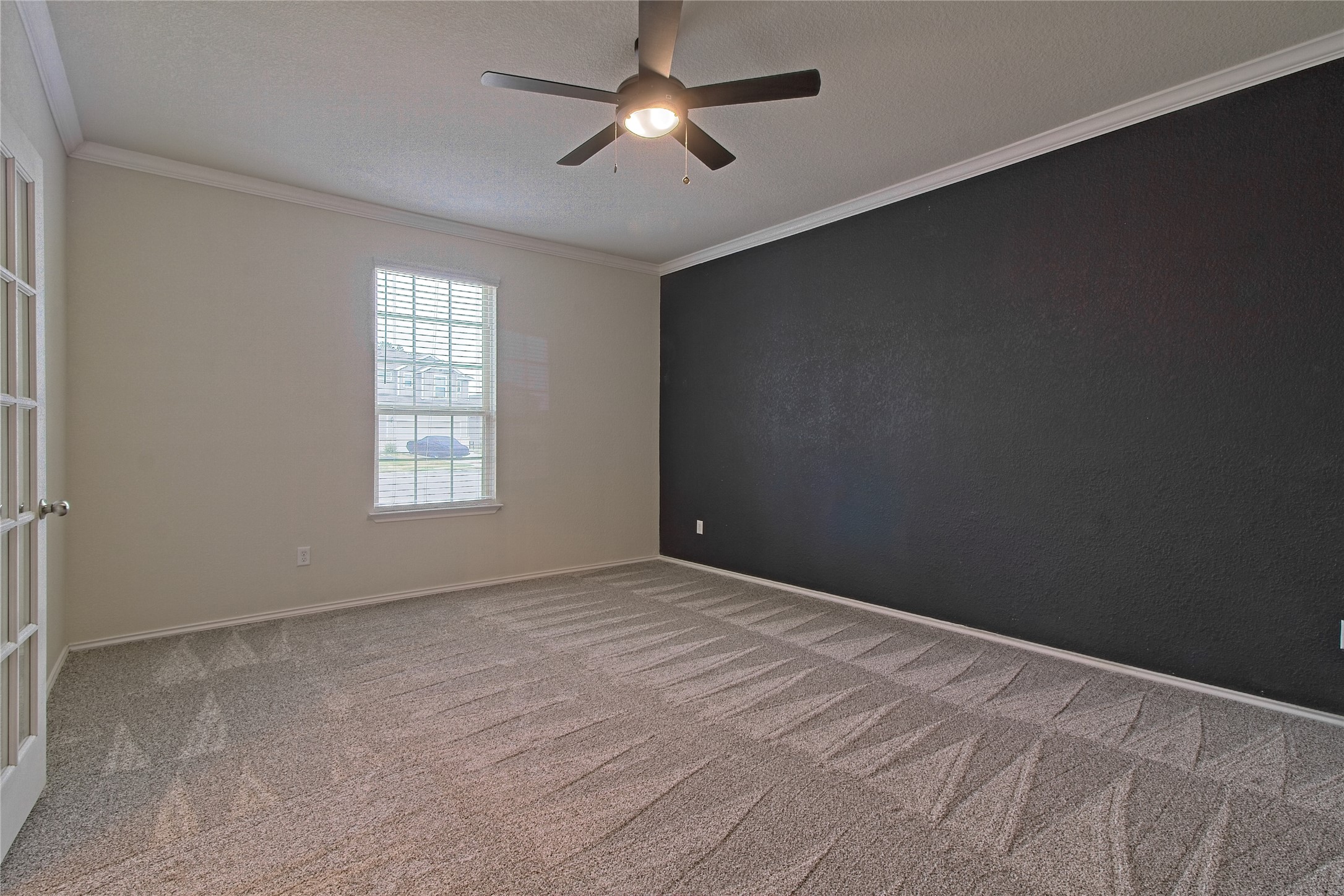 601 Hummingbird Lane Leander, TX 78641 - Photo 6 of 35 Empty room with crown molding, ceiling fan, and light colored carpet