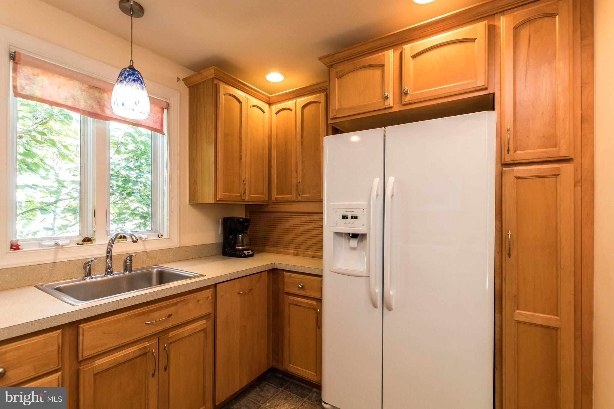 1117 Arran Road Baltimore, MD 21239 - Photo 12 of 25 a kitchen with stainless steel appliances granite countertop a refrigerator and a sink