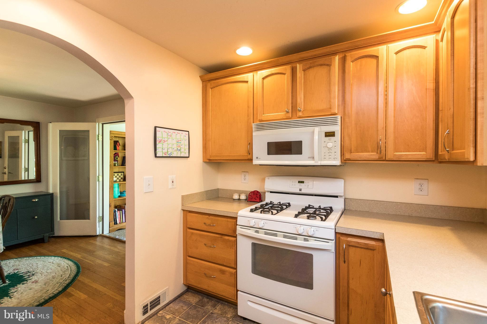 1117 Arran Road Baltimore, MD 21239 - Photo 13 of 25 a kitchen with a stove and a sink