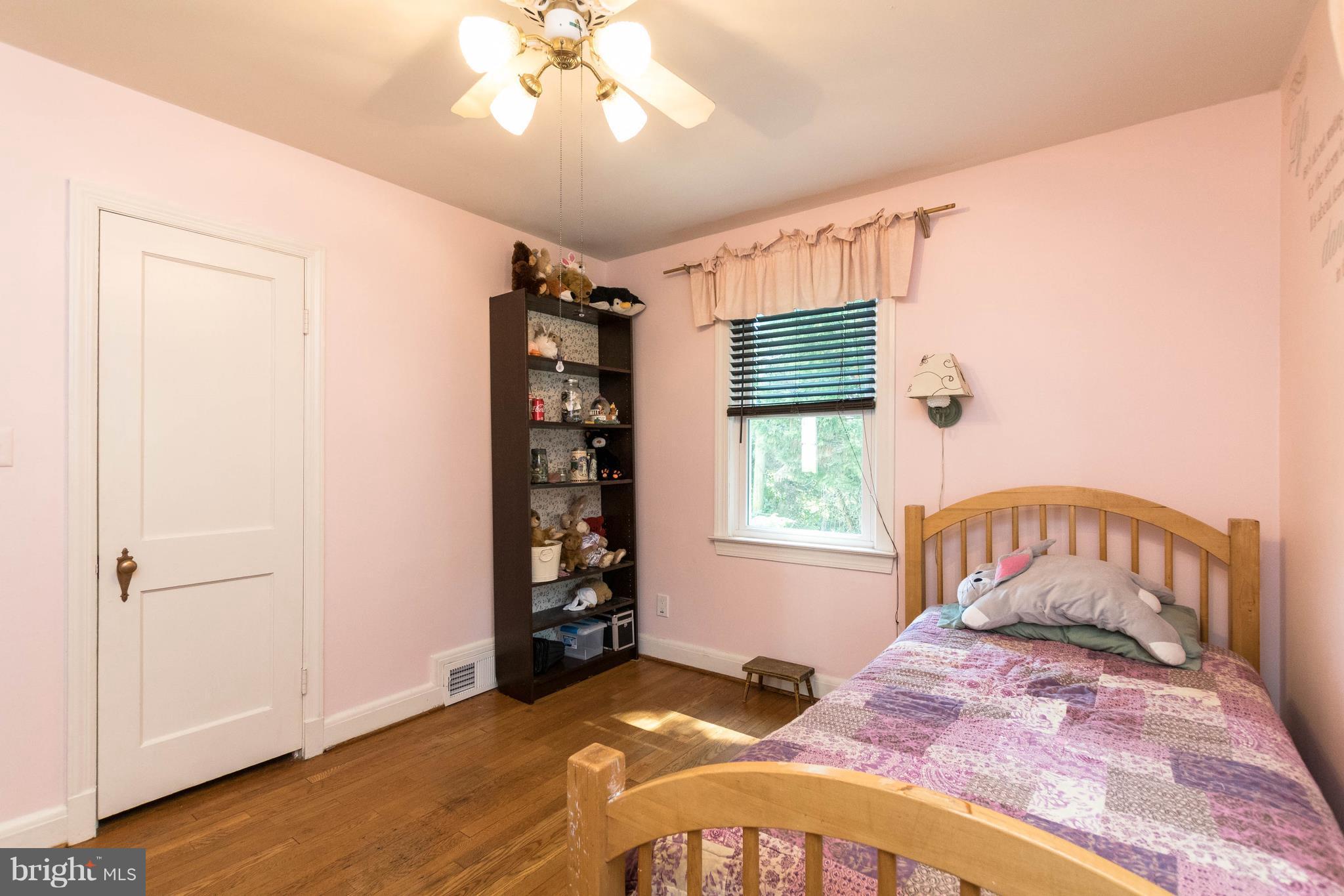 1117 Arran Road Baltimore, MD 21239 - Photo 17 of 25 wooden floor in an empty room with a window