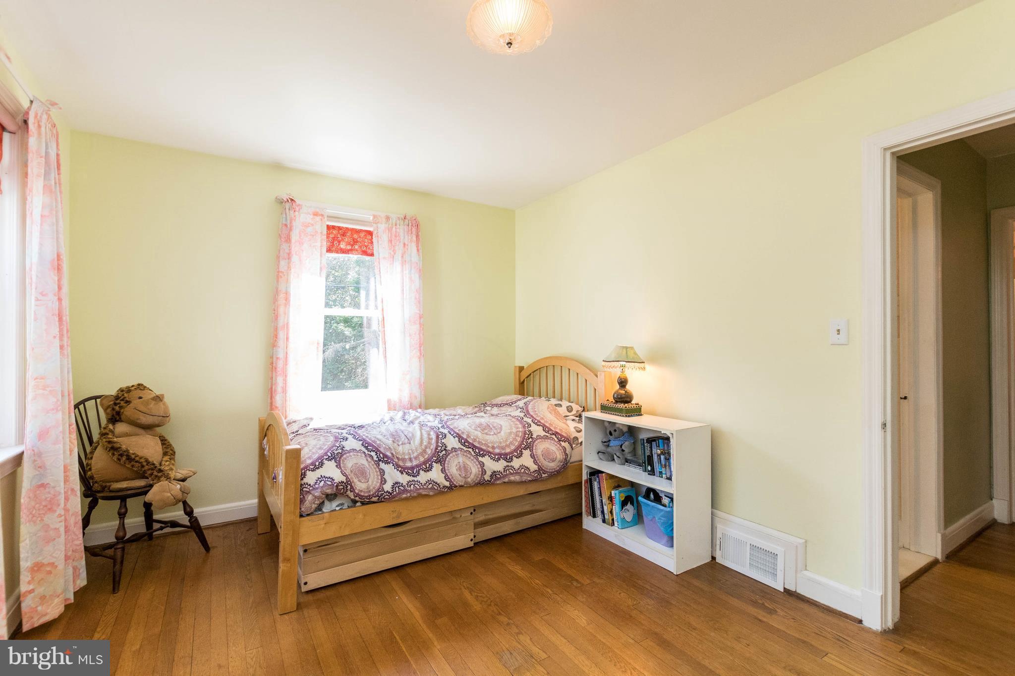 1117 Arran Road Baltimore, MD 21239 - Photo 18 of 25 a bedroom with a bed and a window