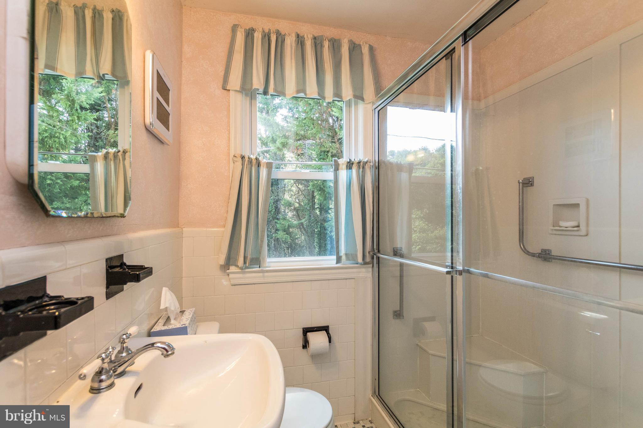 1117 Arran Road Baltimore, MD 21239 - Photo 19 of 25 a bathroom with a sink and a window