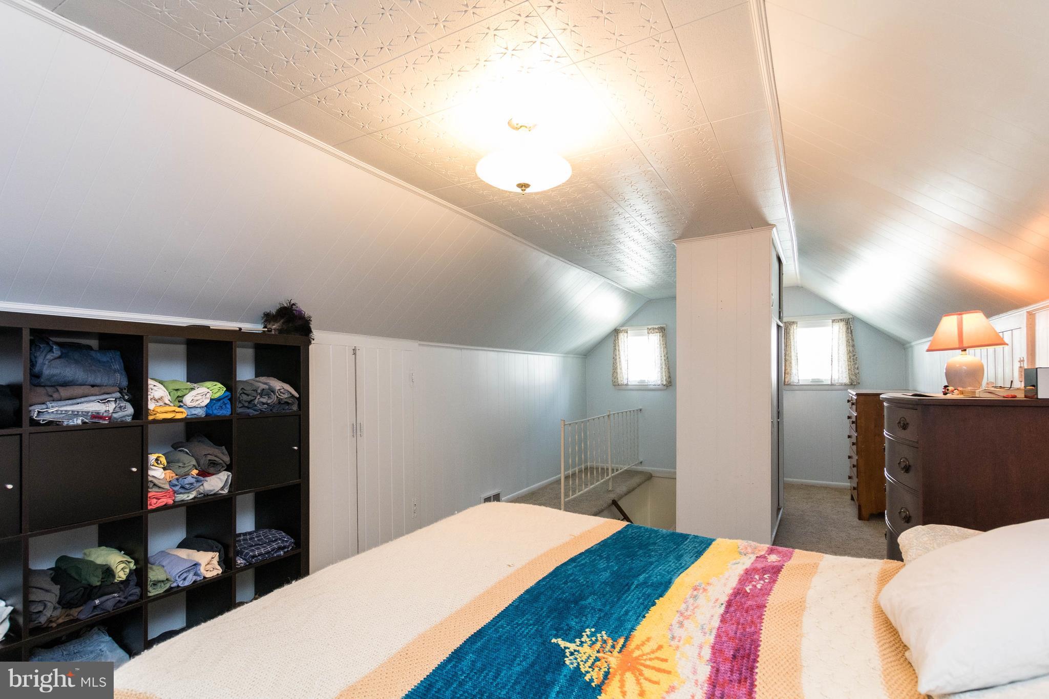 1117 Arran Road Baltimore, MD 21239 - Photo 20 of 25 a bedroom with a bed and a potted plant
