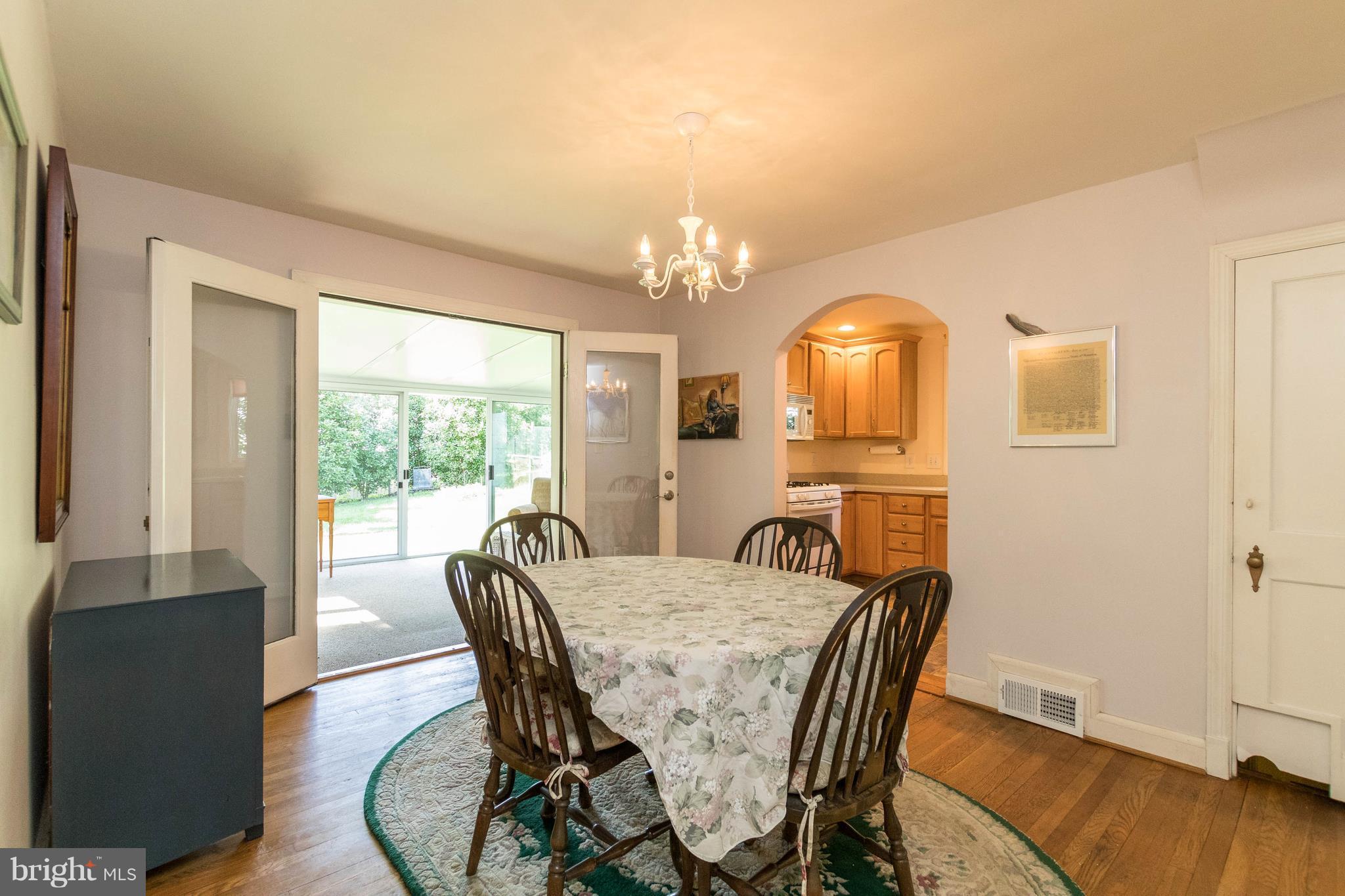 1117 Arran Road Baltimore, MD 21239 - Photo 3 of 25 a view of a dining room with furniture window and wooden floor