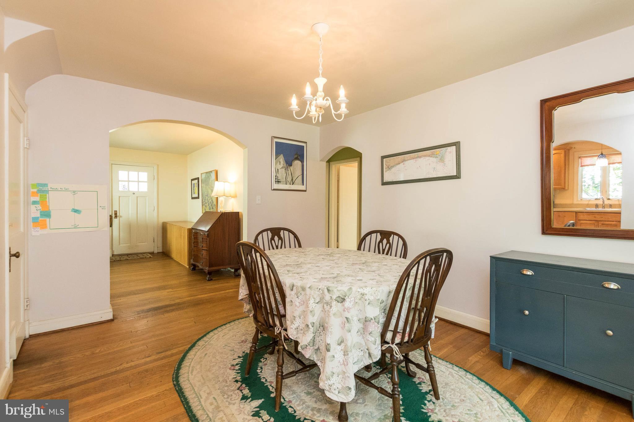 1117 Arran Road Baltimore, MD 21239 - Photo 9 of 25 a view of a dining room with furniture and a chandelier