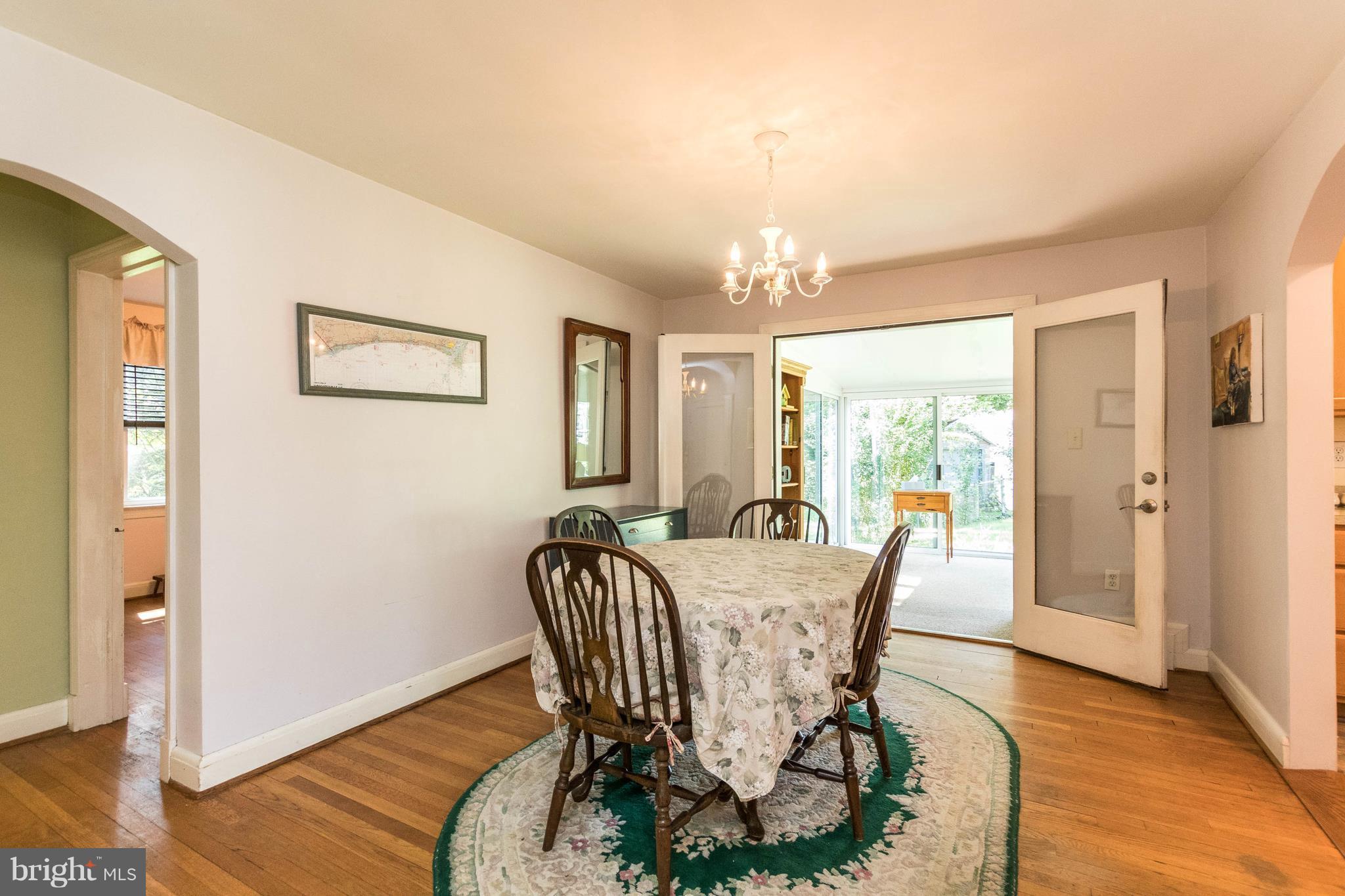 1117 Arran Road Baltimore, MD 21239 - Photo 10 of 25 a view of a dining room with furniture window and wooden floor