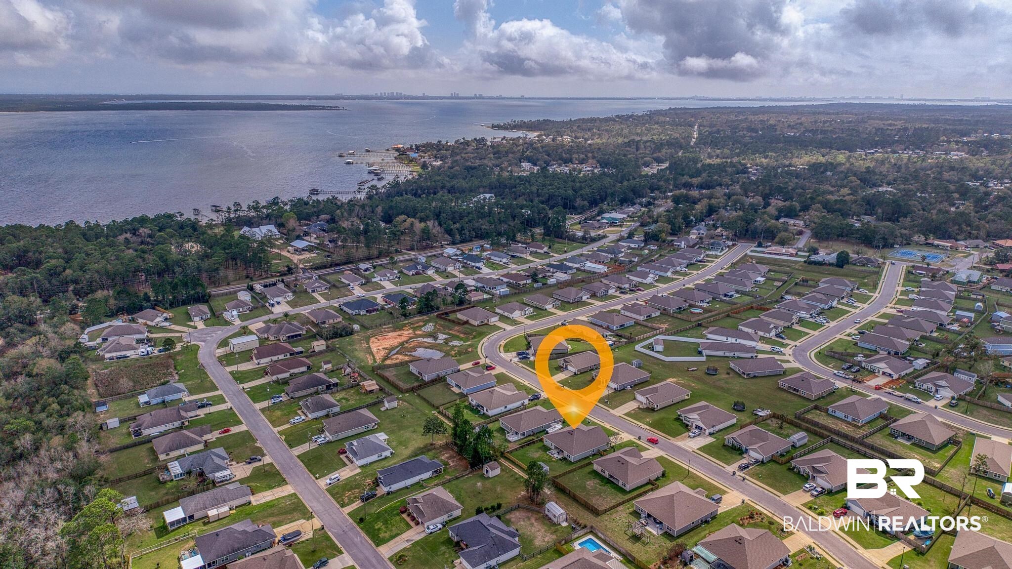 3078 Camino Real Loop Lillian, AL 36549 - Photo 31 of 51 Aerial view of residential area with a large body of water