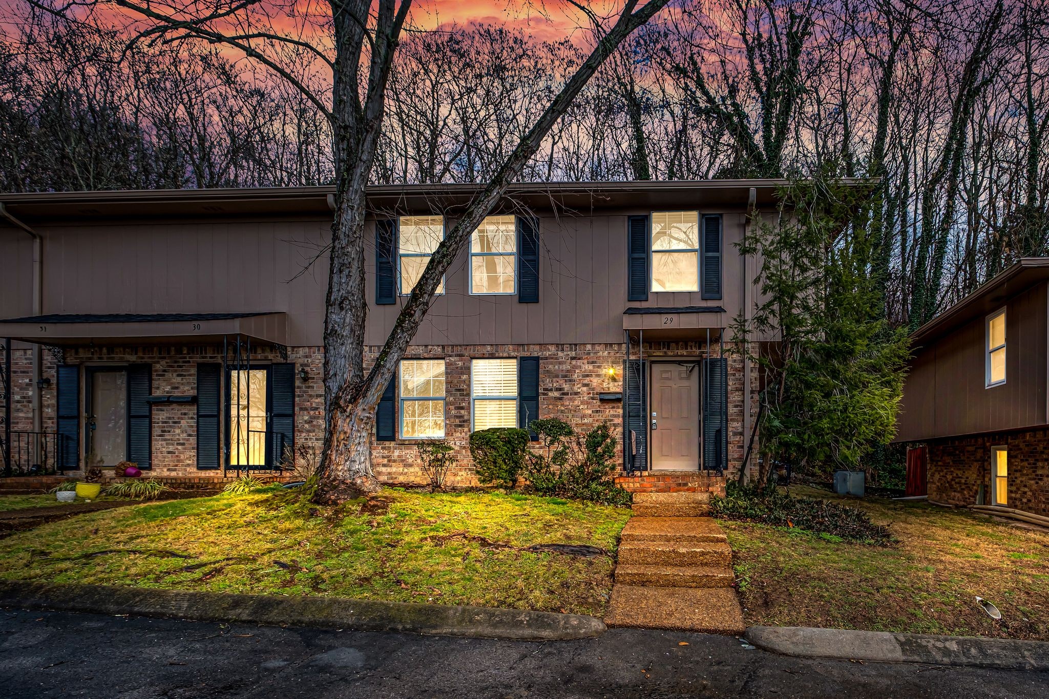110 Bellevue Road, Unit 29 Nashville, TN 37221 - Photo 2 of 22 a view of a brick house with large windows