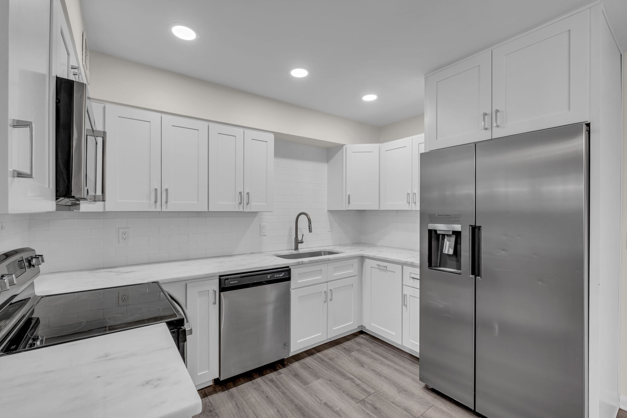 110 Bellevue Road, Unit 29 Nashville, TN 37221 - Photo 4 of 22 a kitchen with a refrigerator sink and cabinets