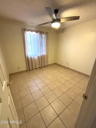 a view of an empty room and a window