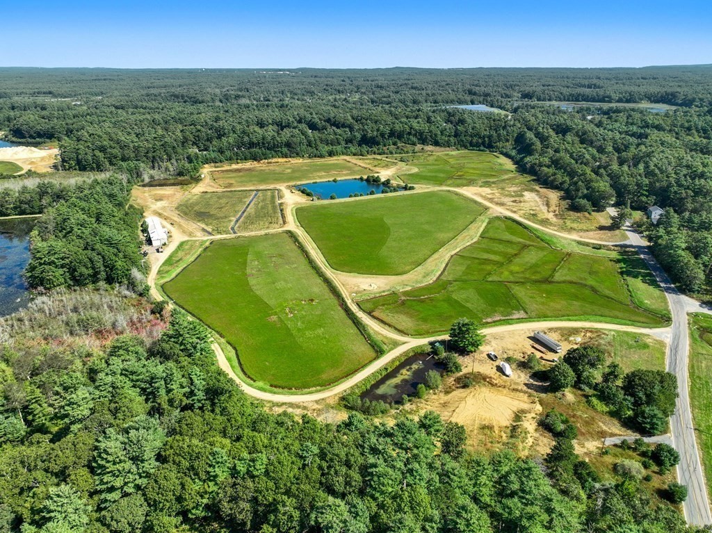 0 Silva Street Carver, MA 02330 - Photo 3 of 25 an aerial view of a swimming pool and mountain view