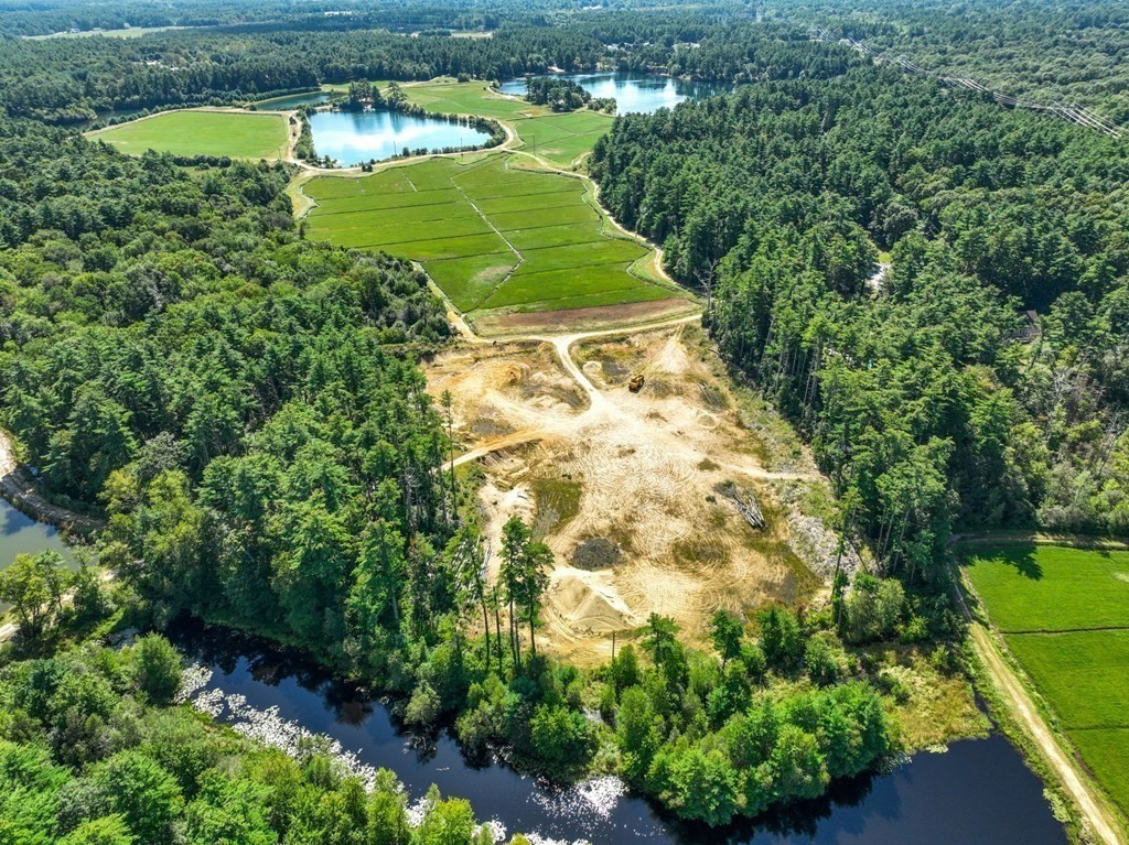 0 Silva Street Carver, MA 02330 - Photo 7 of 25 a green field with lots of trees in the background