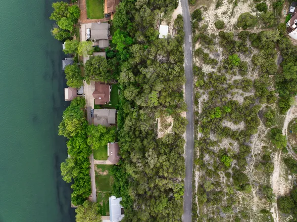 an aerial view of a house with a yard and garden
