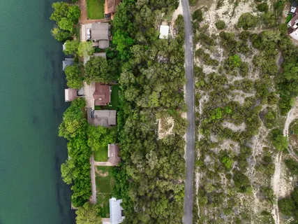 an aerial view of a house with a yard and garden