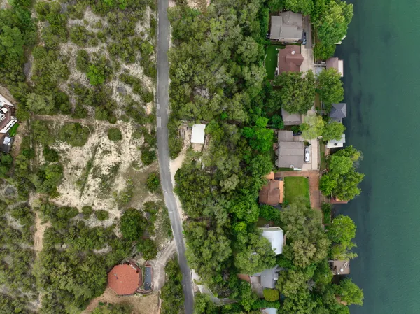 an aerial view of a house with a yard