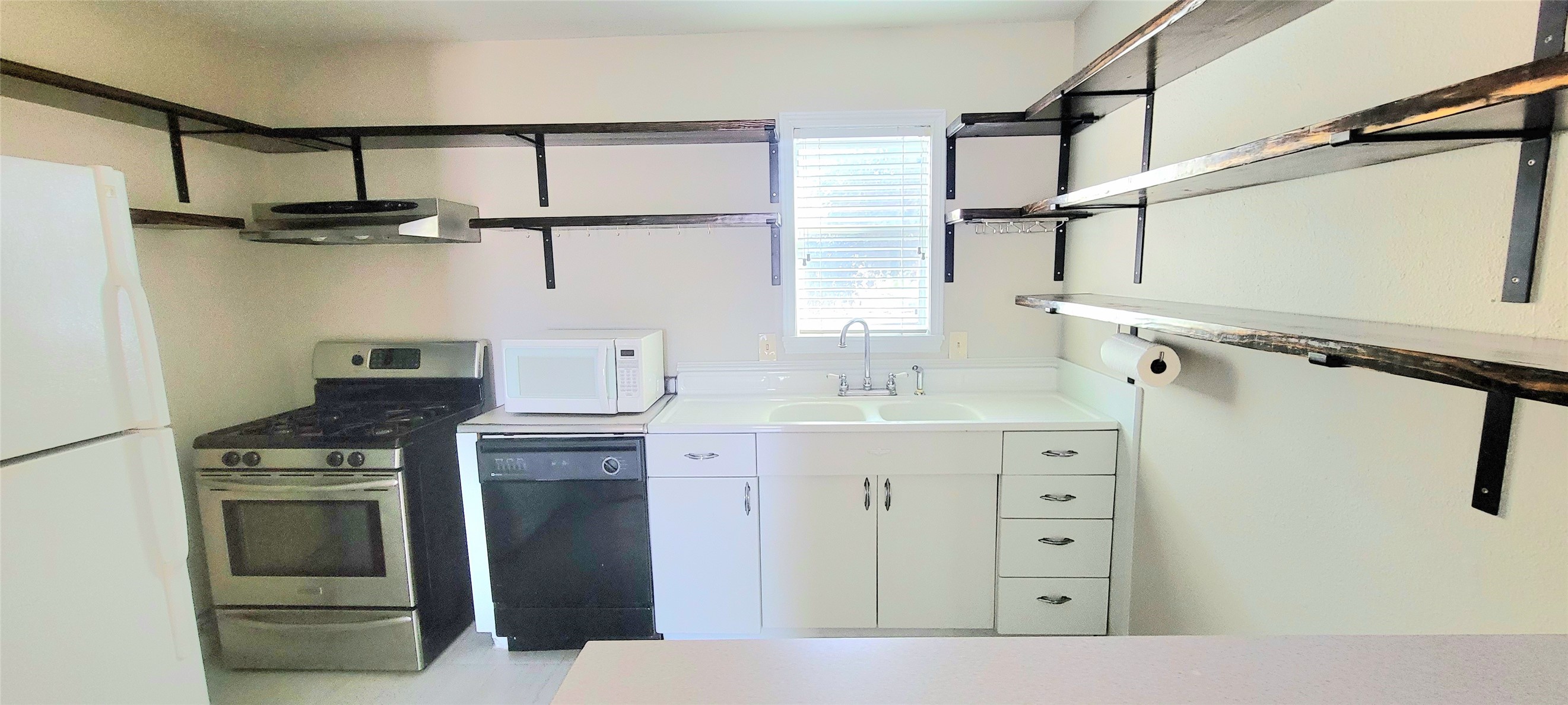 1401 Truxillo Street Houston, TX 77004 - Photo 16 of 20 a kitchen with a stove and a sink