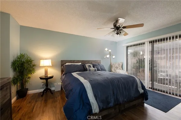 a bedroom with a bed and a mirror