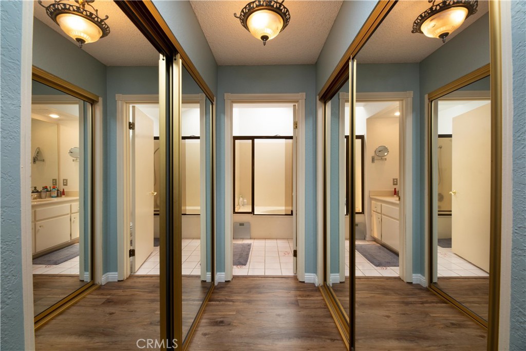 2583 Sandpebble Lane Brea, CA 92821 - Photo 15 of 27 a view of a hallway view with wooden floor and staircase
