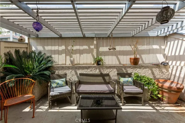 a view of a patio with table and chairs with wooden floor